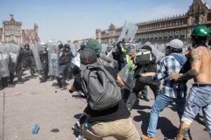 Thousands Protest in Mexico as Clashes Leave 120 Injured