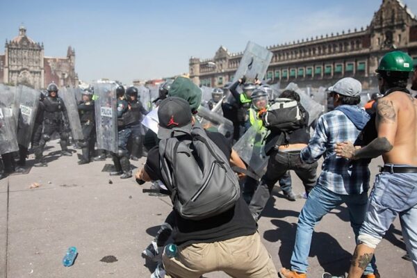Thousands Protest in Mexico as Clashes Leave 120 Injured