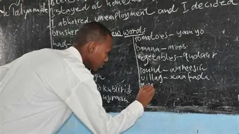 A graduate filling out the online application for the FG six-month teacher certification program on a computer.