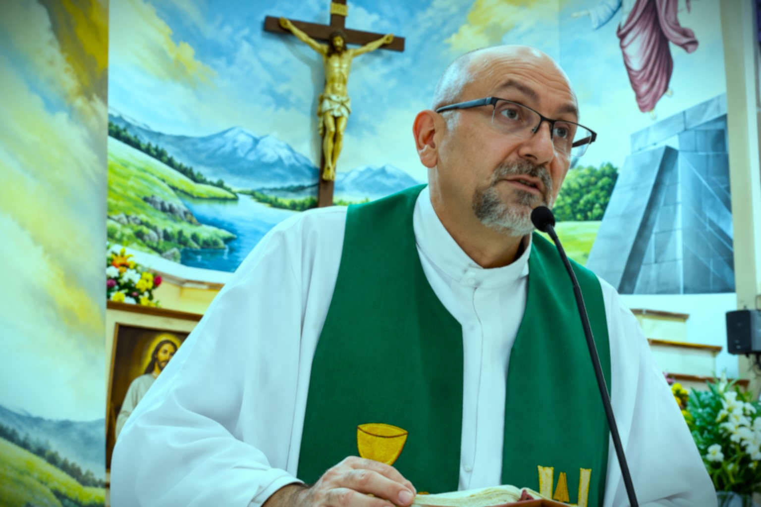 Police tape around the altar after a priest dies as cross falls on him during livestreamed mass.
