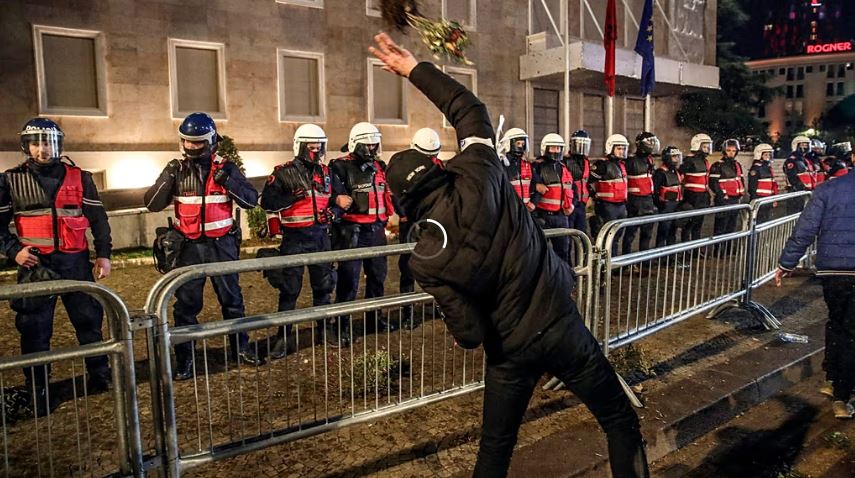 Riot police firing tear gas during violent clashes with anti-government protesters in Tirana, Albania.